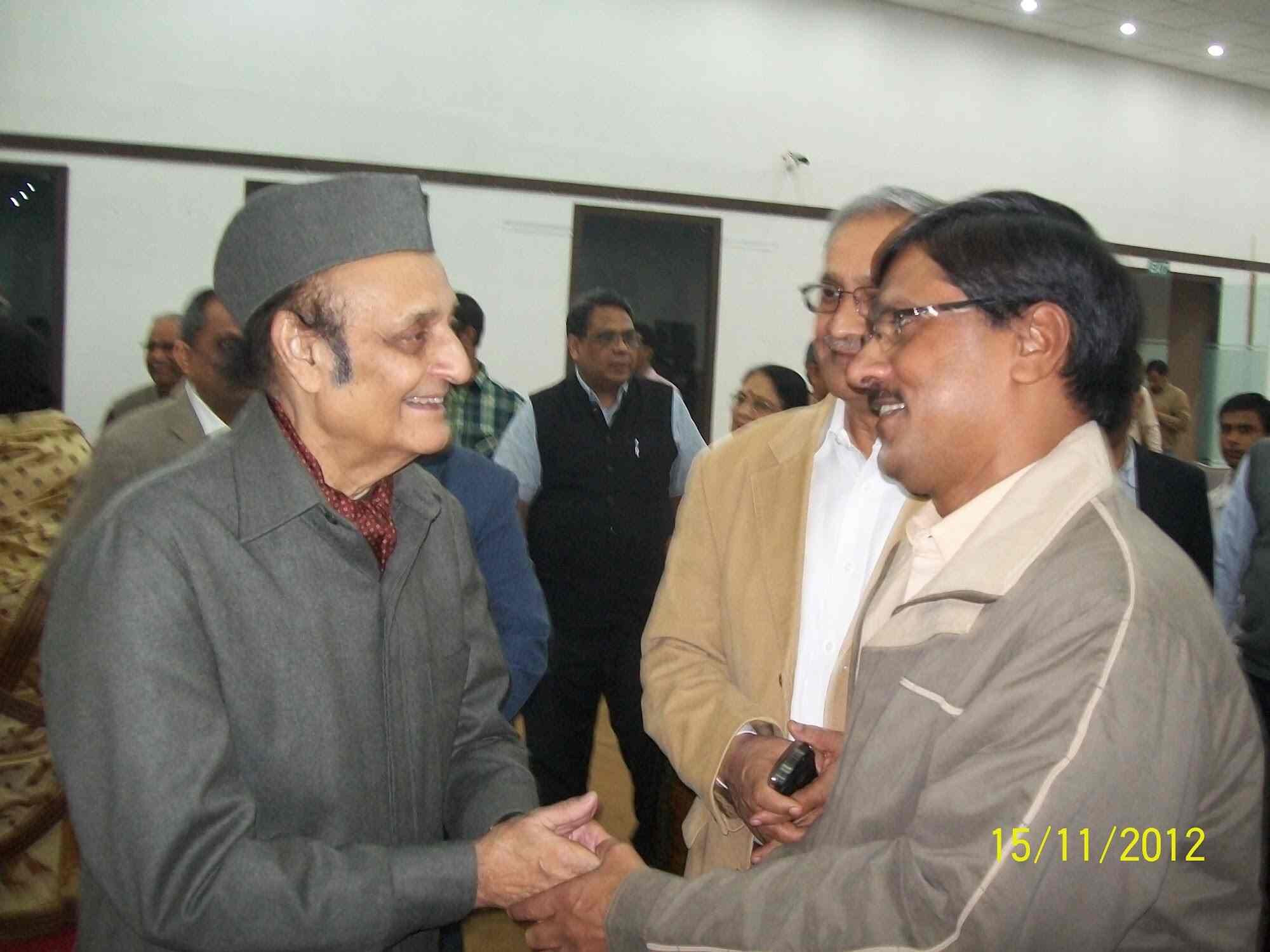 Trust delegation meeting an elder political dignitary in Nehru-cap, exchanging greetings, November 2012