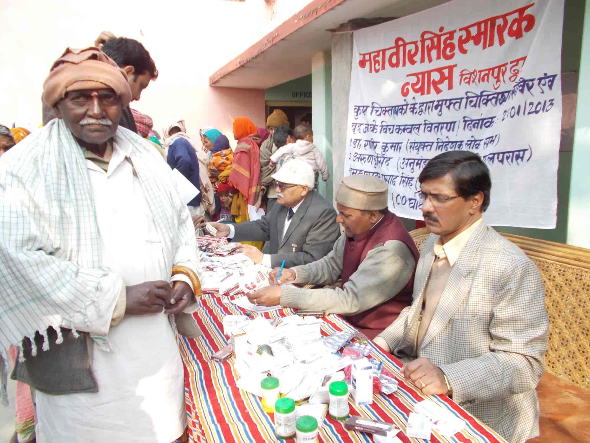 Free medical camp run by the Trust — distribution of medicines to villagers, January 2013