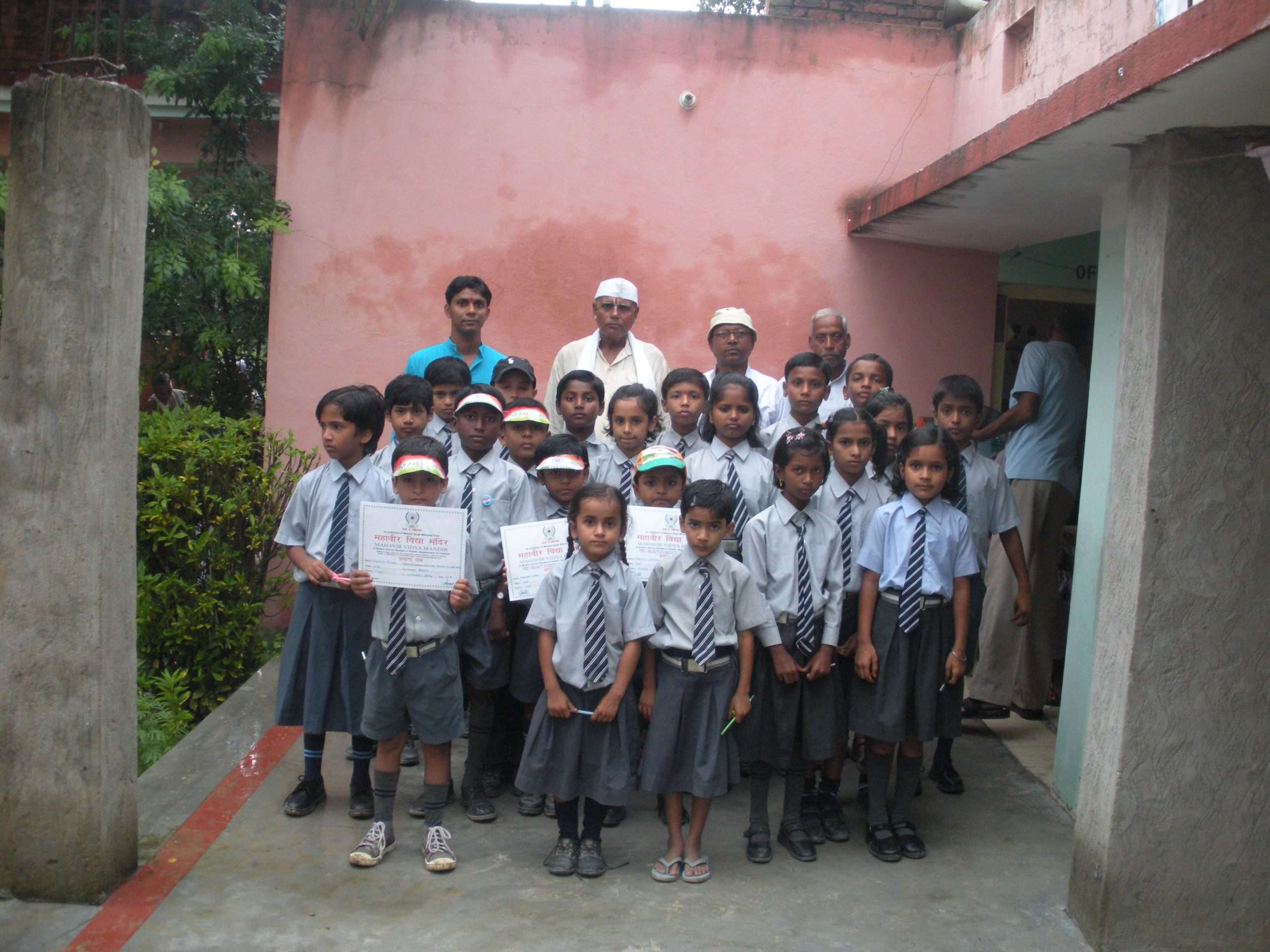 Students with certificates after completion ceremony at the Trust school